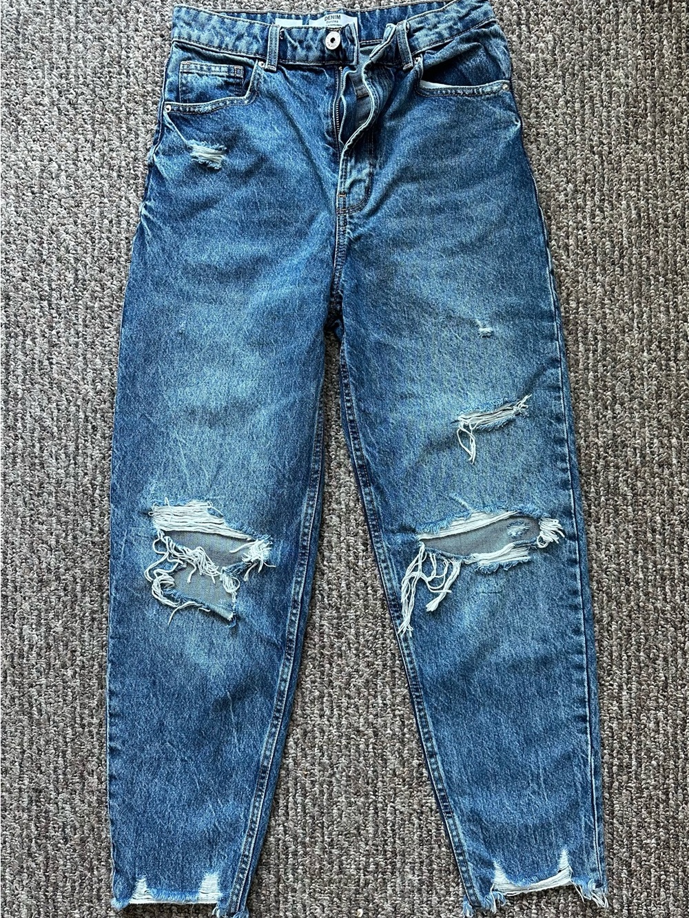 Bershka high-waisted distressed mom jeans in a medium wash